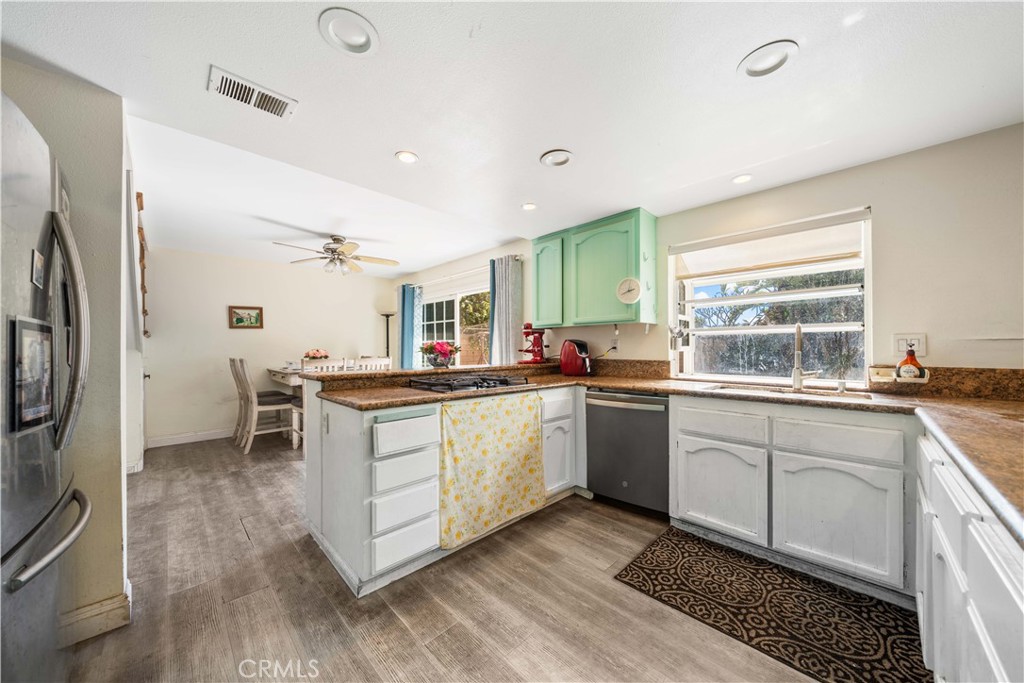 38 Carver Irvine, CA 92620 - Photo 17 of 55 a kitchen with sink cabinets and stainless steel appliances