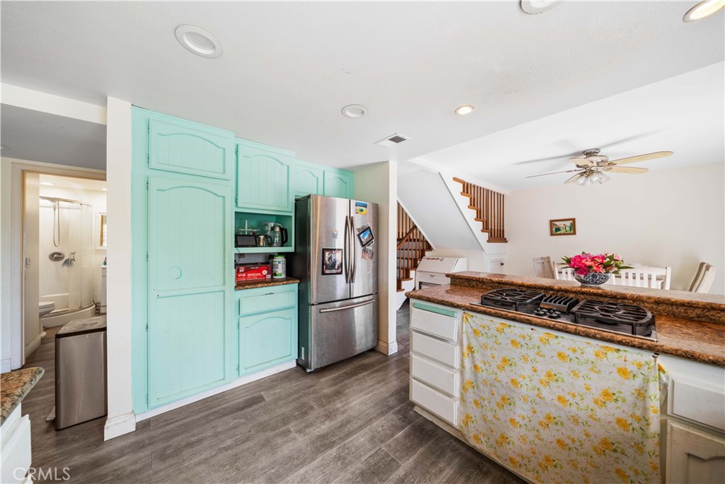 38 Carver Irvine, CA 92620 - Photo 19 of 55 a kitchen with stainless steel appliances a refrigerator and a wooden floor