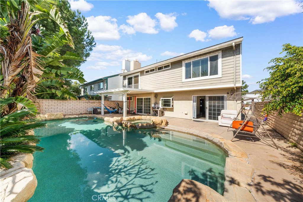 38 Carver Irvine, CA 92620 - Photo 26 of 55 a view of a house with backyard sitting area and garden