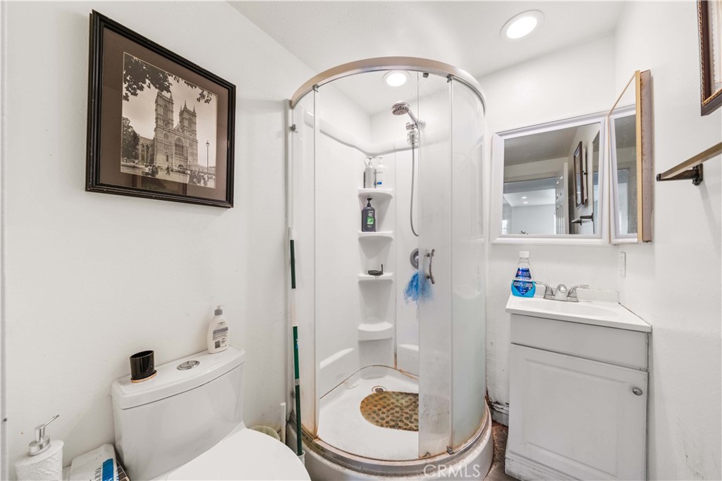 38 Carver Irvine, CA 92620 - Photo 27 of 55 a bathroom with a toilet a sink and a mirror