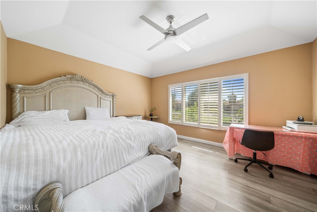 38 Carver Irvine, CA 92620 - Photo 29 of 55 a bedroom with a bed a chair and a large window