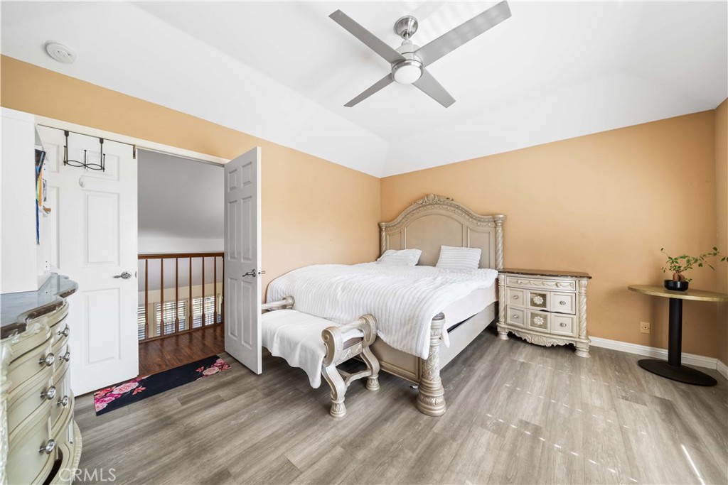 38 Carver Irvine, CA 92620 - Photo 30 of 55 a bedroom with a bed and wooden floor