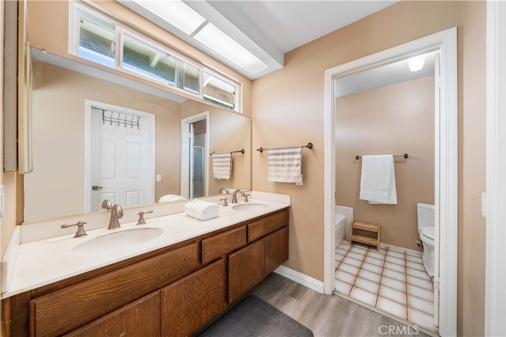 38 Carver Irvine, CA 92620 - Photo 32 of 55 a en suite bathroom with a sink and a mirror