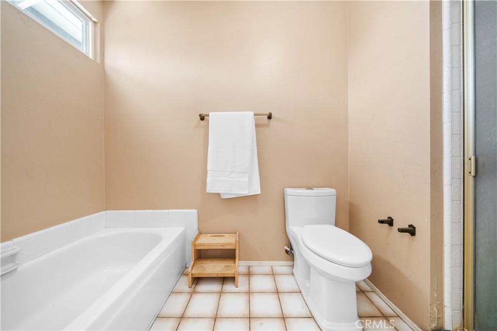 38 Carver Irvine, CA 92620 - Photo 34 of 55 a bathroom with a toilet and a bathtub