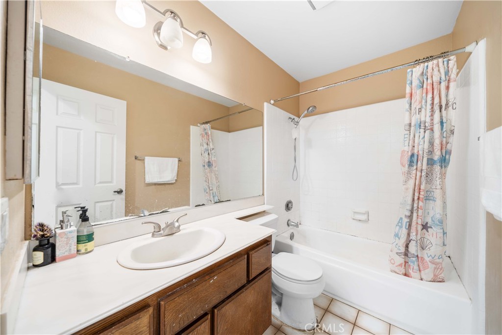38 Carver Irvine, CA 92620 - Photo 40 of 55 a bathroom with a double vanity sink toilet mirror and shower