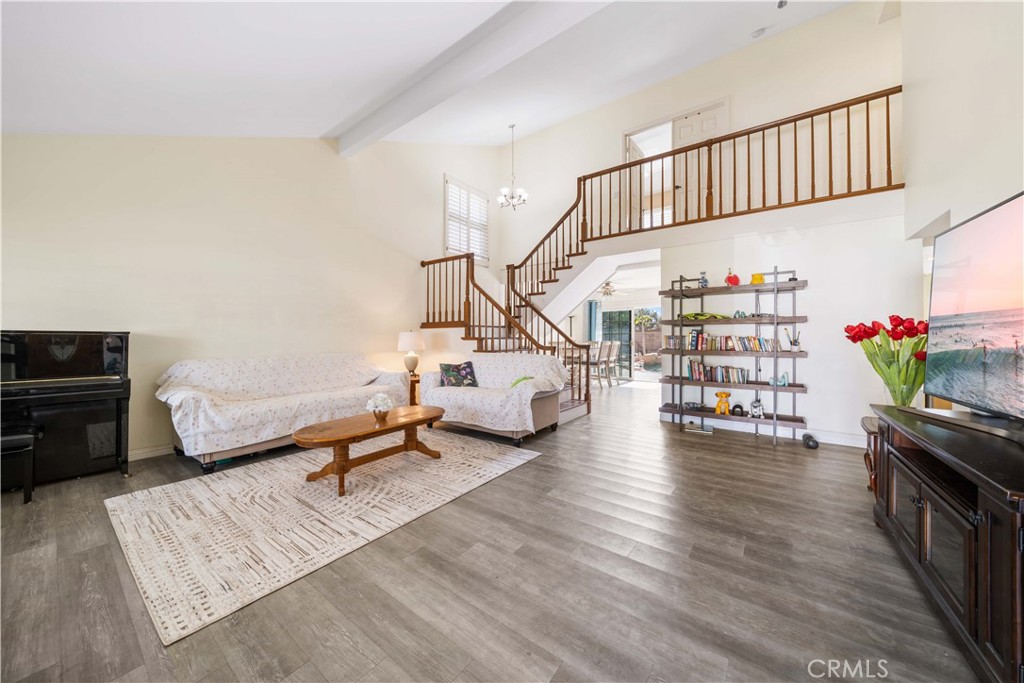 38 Carver Irvine, CA 92620 - Photo 7 of 55 a living room with furniture and a book shelf