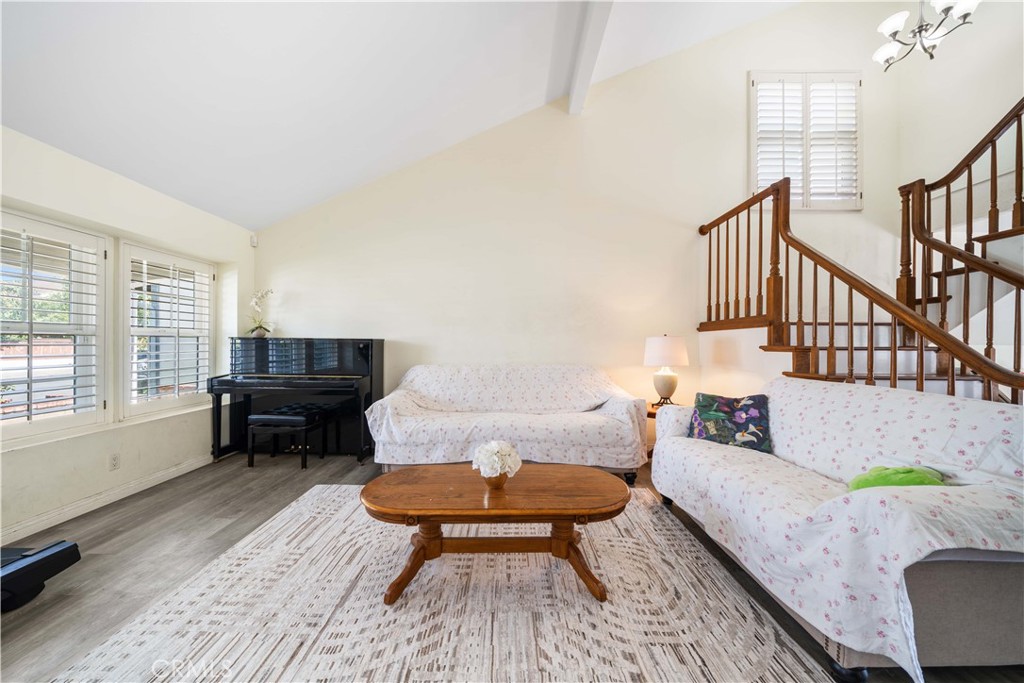 38 Carver Irvine, CA 92620 - Photo 8 of 55 a living room with furniture fireplace and a table