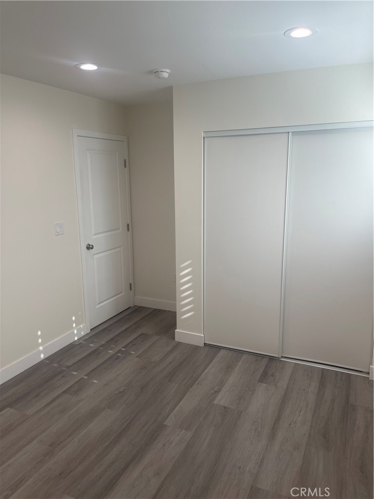 4656 Bell Place, Unit B Bell, CA 90201 - Photo 11 of 15 wooden floor in an empty room