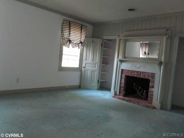 10819 Cherokee Road Midlothian, VA 23113 - Photo 13 of 24 a view of empty room with a fireplace