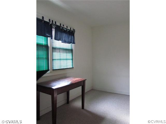 10819 Cherokee Road Midlothian, VA 23113 - Photo 15 of 24 a room with a table and furniture