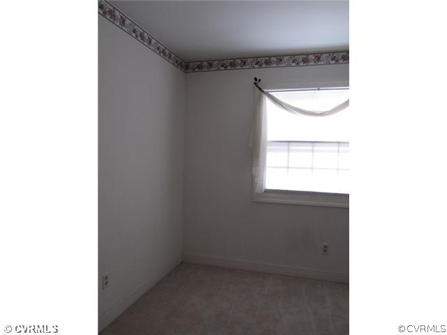 10819 Cherokee Road Midlothian, VA 23113 - Photo 16 of 24 a bathroom with a window