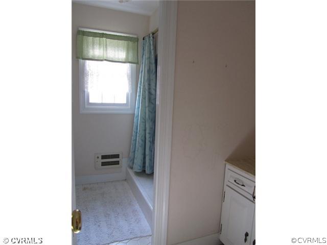 10819 Cherokee Road Midlothian, VA 23113 - Photo 19 of 24 a view of a hallway and a room with mirror