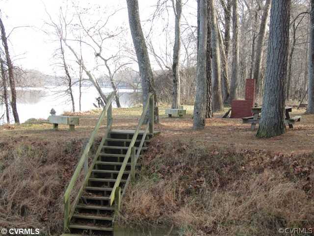 10819 Cherokee Road Midlothian, VA 23113 - Photo 24 of 24 a backyard of a house with lots of green space