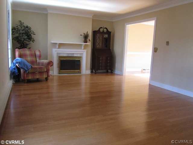 10819 Cherokee Road Midlothian, VA 23113 - Photo 6 of 24 a view of livingroom with furniture and a fireplace