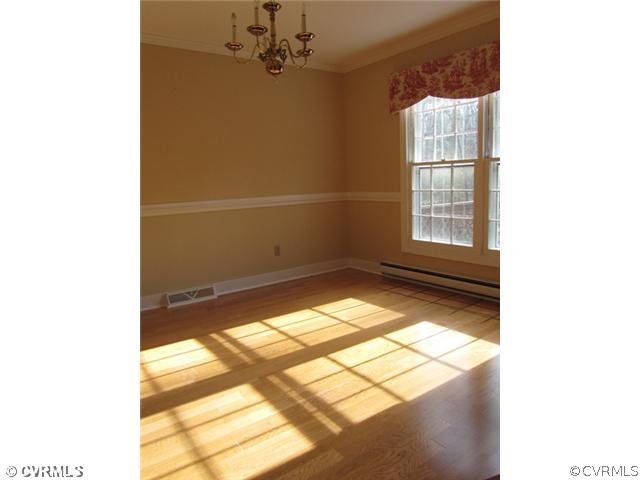 10819 Cherokee Road Midlothian, VA 23113 - Photo 7 of 24 a view of a window in an empty room