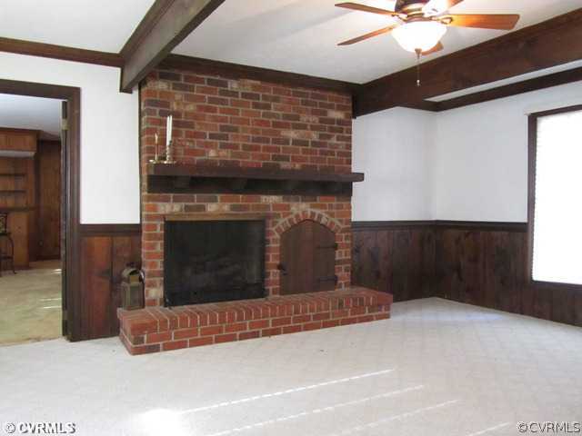 10819 Cherokee Road Midlothian, VA 23113 - Photo 8 of 24 a living room with a fireplace