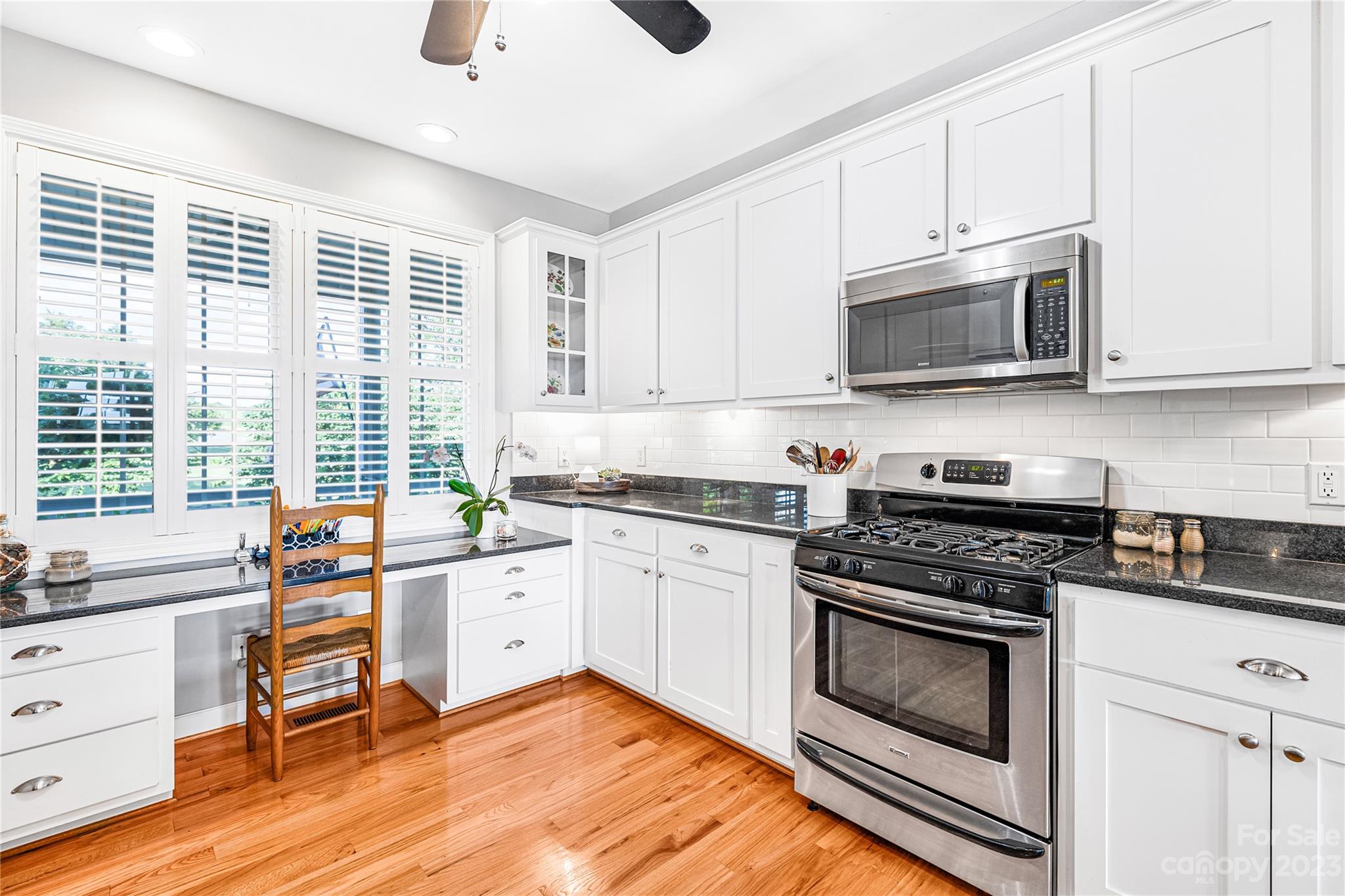 5423 Reepsville Road Vale, NC 28168 - Photo 16 of 48 a kitchen with stainless steel appliances white cabinets and a stove top oven