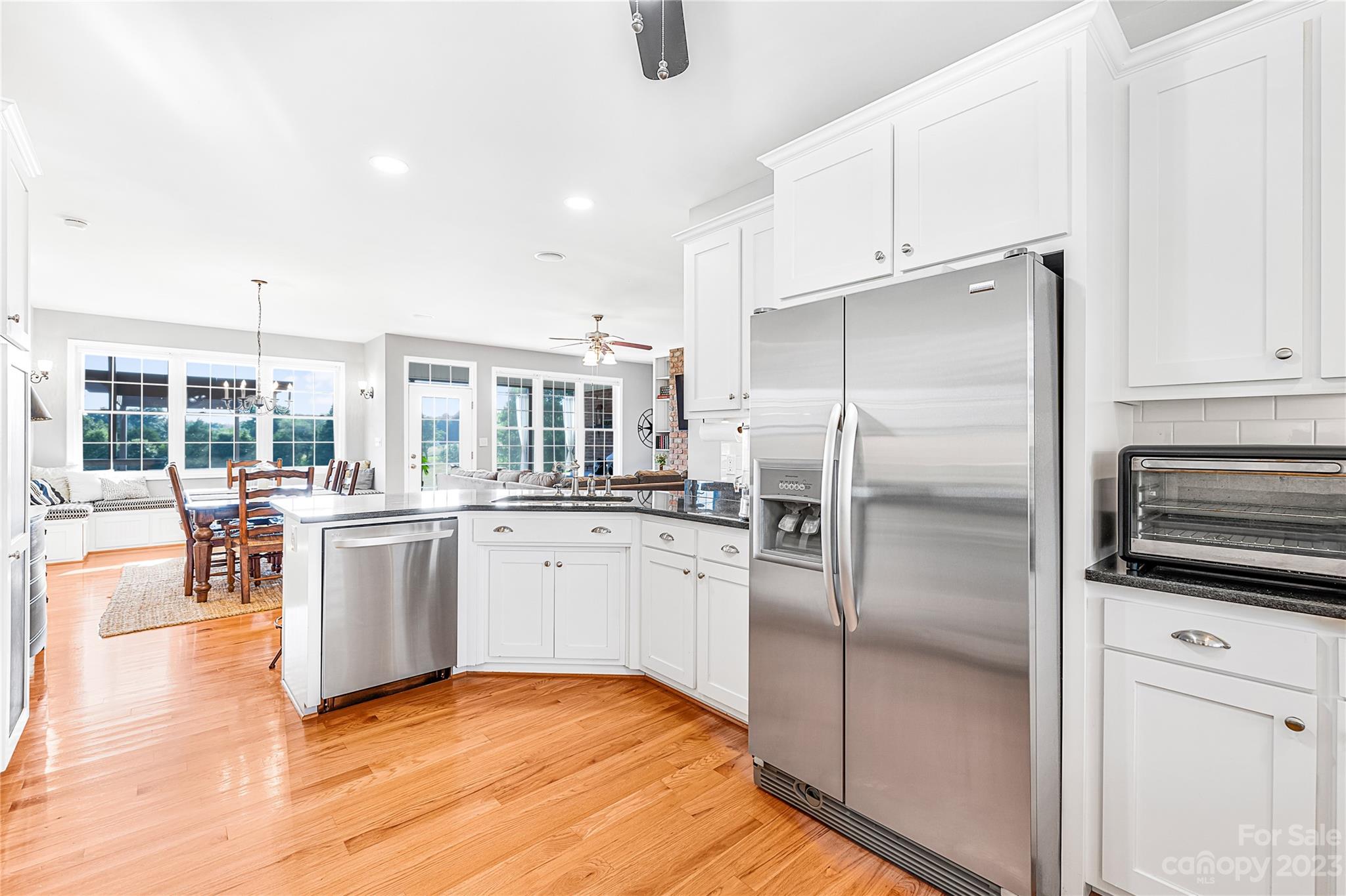 5423 Reepsville Road Vale, NC 28168 - Photo 17 of 48 a kitchen with white cabinets and stainless steel appliances
