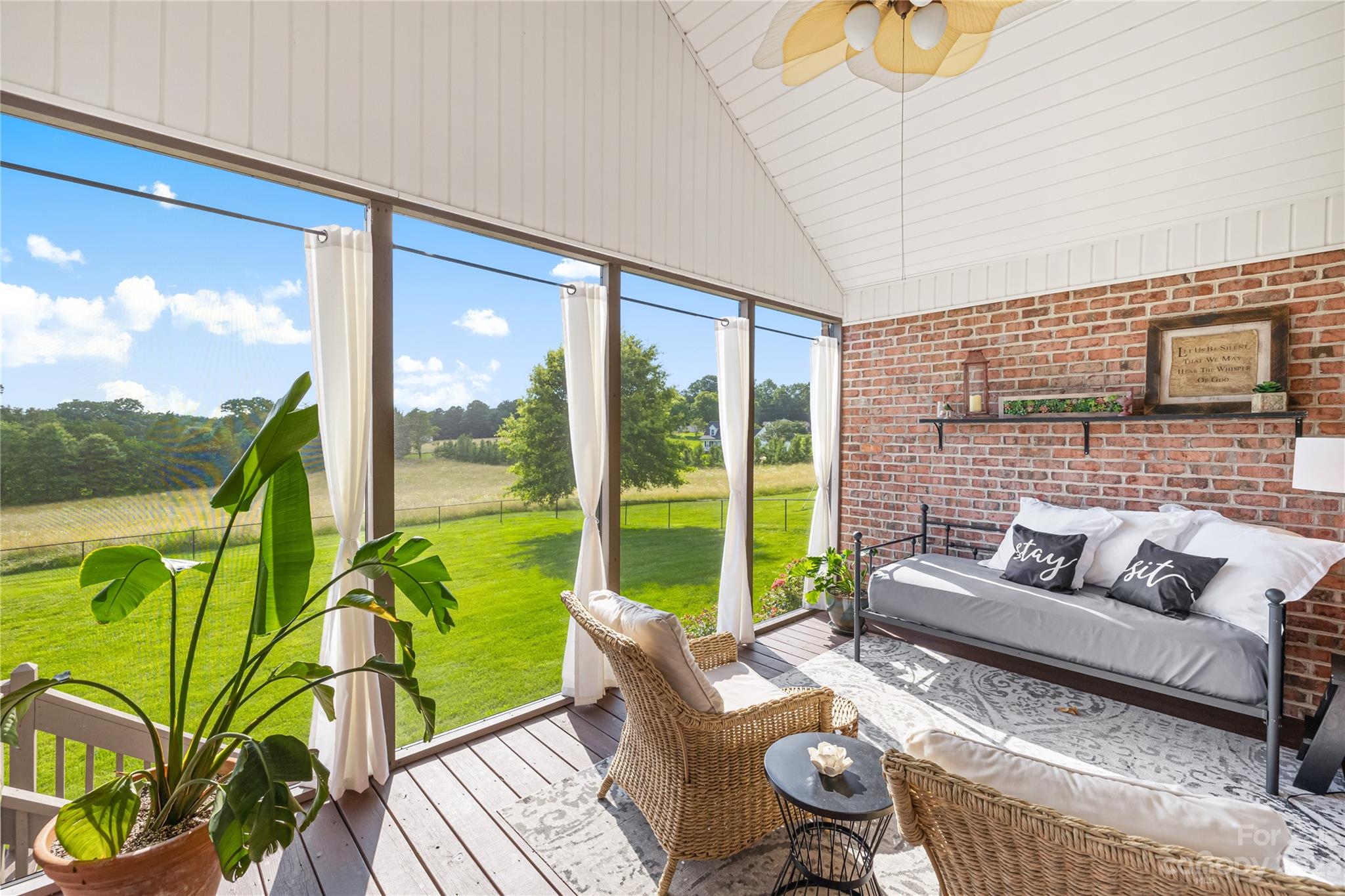 5423 Reepsville Road Vale, NC 28168 - Photo 27 of 48 a living room with patio furniture and a floor to ceiling window