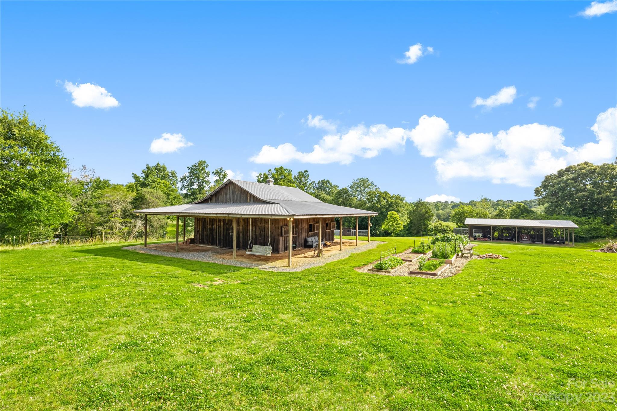 5423 Reepsville Road Vale, NC 28168 - Photo 40 of 48 a view of a house with a yard patio and swimming pool