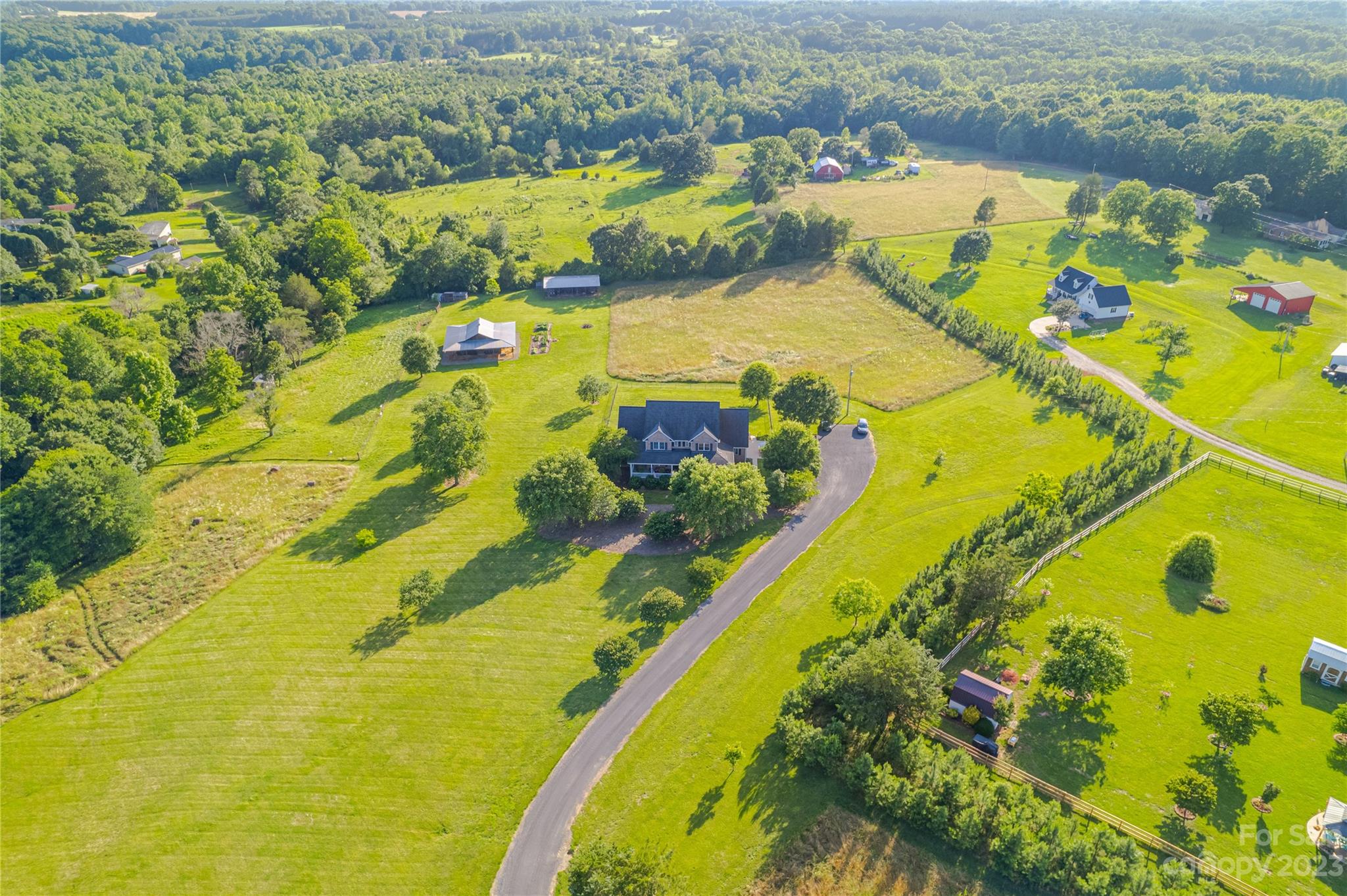 5423 Reepsville Road Vale, NC 28168 - Photo 46 of 48 an aerial view of residential houses with swimming pool