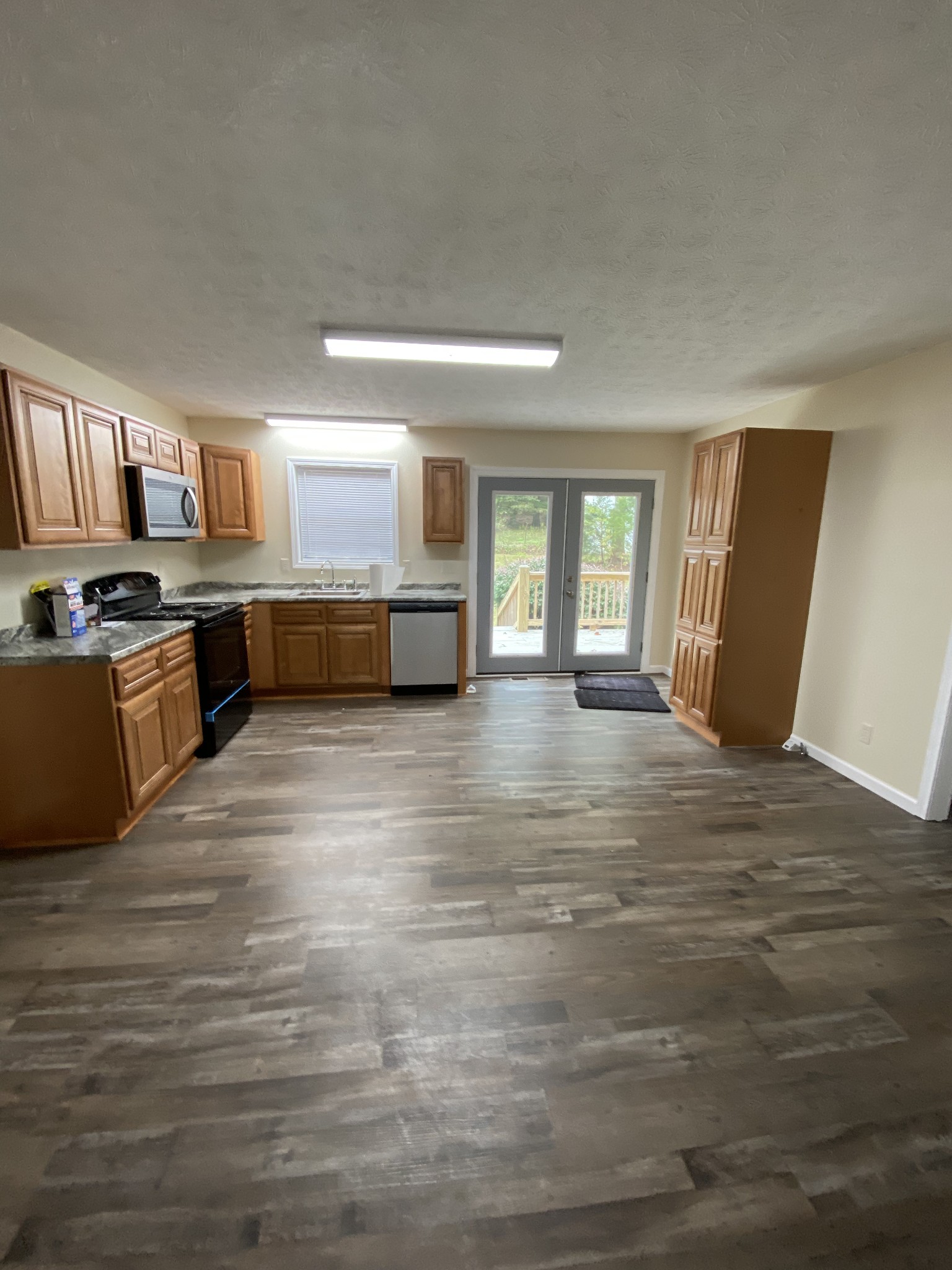 400 Hill Top Road Red Boiling Springs, TN 37150 - Photo 3 of 14 a view of a kitchen with a sink cabinets and a window