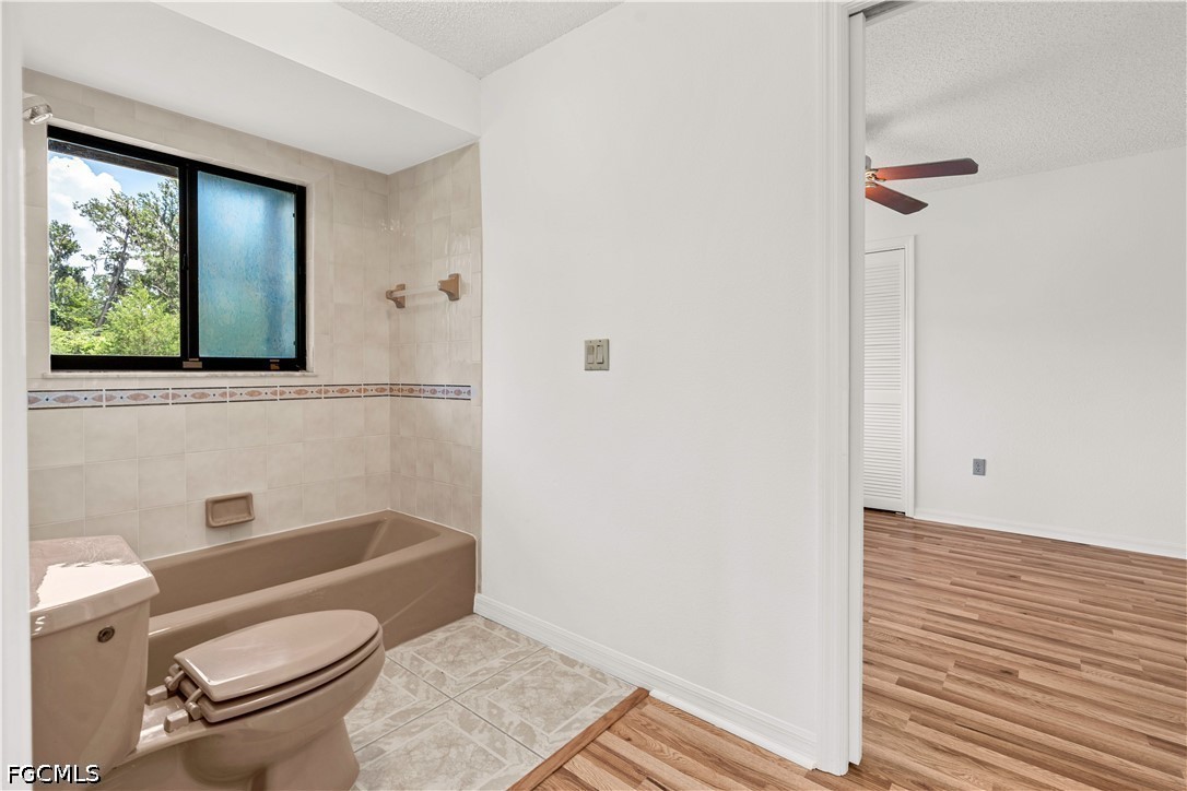 27255 Hickory Hill Road Brooksville, FL 34602 - Photo 35 of 50 a bathroom with a toilet a sink and bathtub