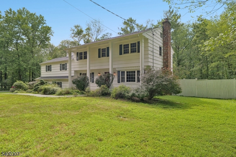 247 Spencer Road Bernards, NJ 07920 - Photo 16 of 48 a front view of a house with garden