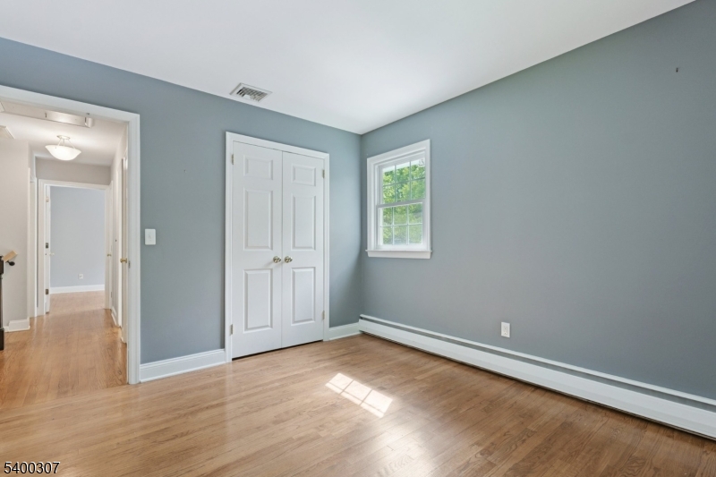 247 Spencer Road Bernards, NJ 07920 - Photo 24 of 48 wooden floor in an empty room