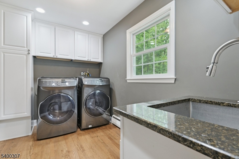 247 Spencer Road Bernards, NJ 07920 - Photo 8 of 48 a utility room with sink dryer and washer