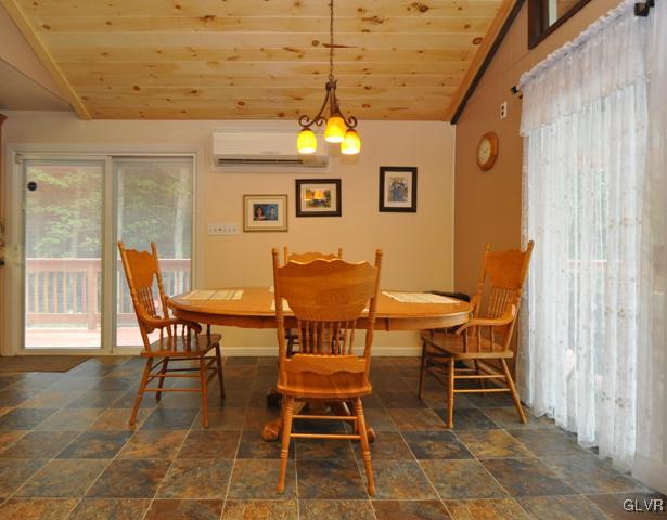 1251 Glenbrook Road Bartonsville, PA 18321 - Photo 12 of 37 a view of a dining room with furniture and chandelier