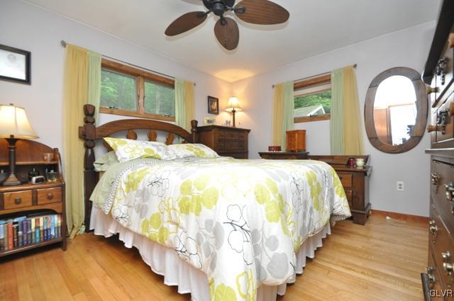 1251 Glenbrook Road Bartonsville, PA 18321 - Photo 13 of 37 a bed room with a bed mirror and a window
