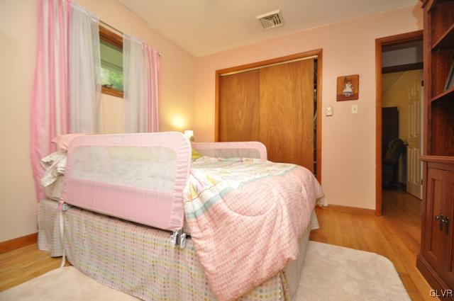 1251 Glenbrook Road Bartonsville, PA 18321 - Photo 17 of 37 a bedroom with a bed and a mirror