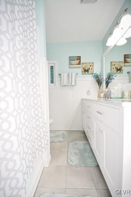 1251 Glenbrook Road Bartonsville, PA 18321 - Photo 18 of 37 a bathroom with a sink a toilet and a shower