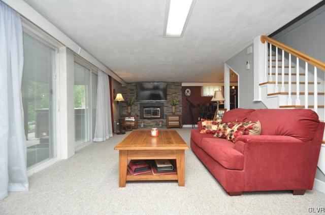 1251 Glenbrook Road Bartonsville, PA 18321 - Photo 20 of 37 a living room with furniture and a flat screen tv