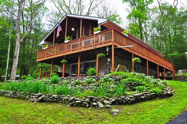 1251 Glenbrook Road Bartonsville, PA 18321 - Photo 2 of 37 a view of house with a yard and potted plants
