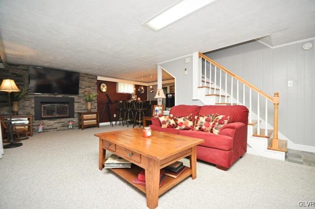 1251 Glenbrook Road Bartonsville, PA 18321 - Photo 22 of 37 a living room with furniture a pool table and a fireplace
