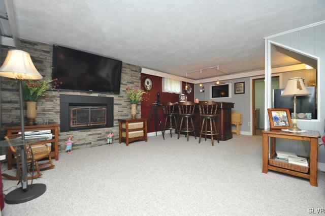 1251 Glenbrook Road Bartonsville, PA 18321 - Photo 23 of 37 a living room with furniture and a flat screen tv