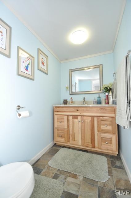 1251 Glenbrook Road Bartonsville, PA 18321 - Photo 26 of 37 a bathroom with a sink a mirror and a toilet