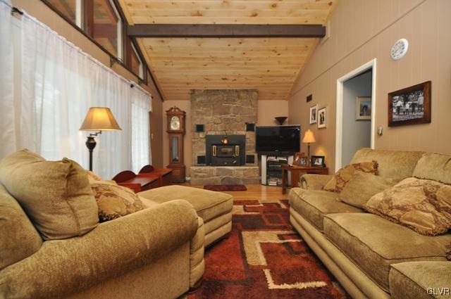 1251 Glenbrook Road Bartonsville, PA 18321 - Photo 3 of 37 a living room with furniture and a fireplace