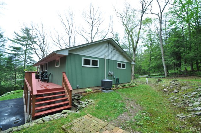 1251 Glenbrook Road Bartonsville, PA 18321 - Photo 31 of 37 a backyard of a house with table and chairs