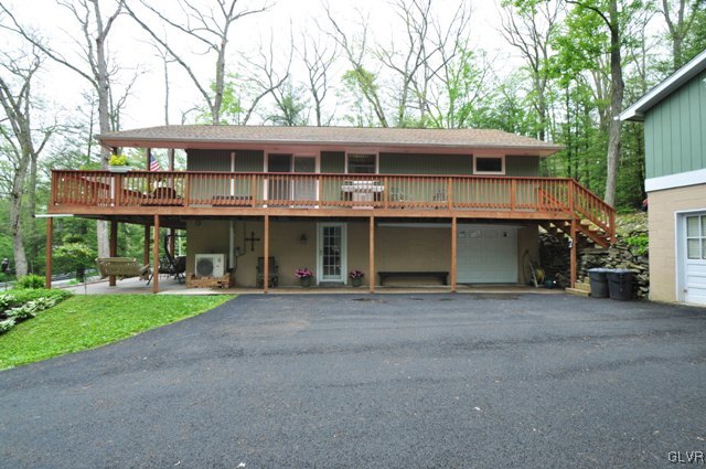 1251 Glenbrook Road Bartonsville, PA 18321 - Photo 32 of 37 a front view of a house with a yard and porch