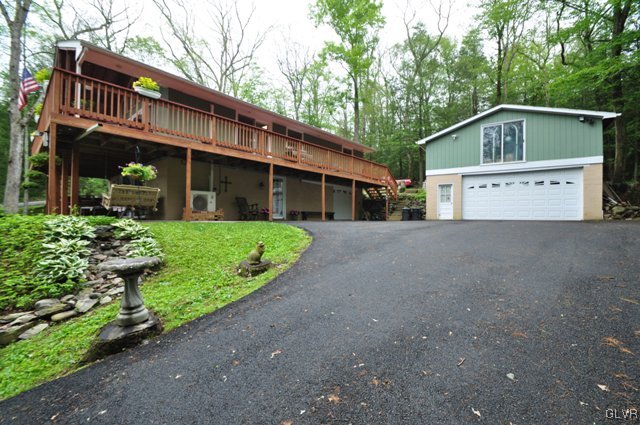 1251 Glenbrook Road Bartonsville, PA 18321 - Photo 33 of 37 a front view of a house with garden