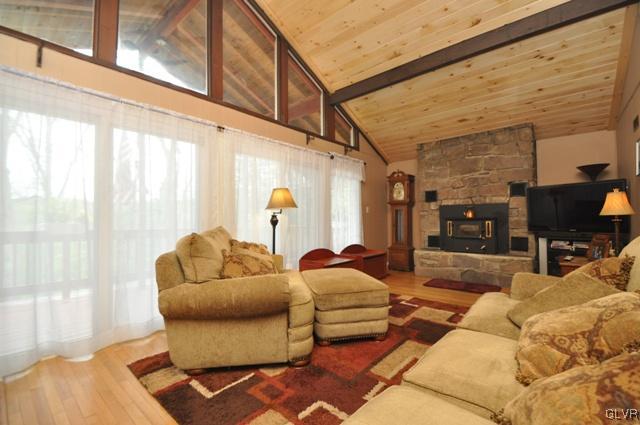 1251 Glenbrook Road Bartonsville, PA 18321 - Photo 4 of 37 a living room with furniture and a floor to ceiling window
