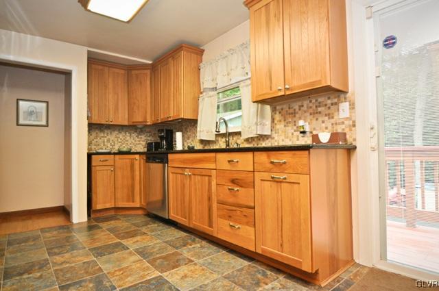 1251 Glenbrook Road Bartonsville, PA 18321 - Photo 8 of 37 a kitchen with granite countertop cabinets and window