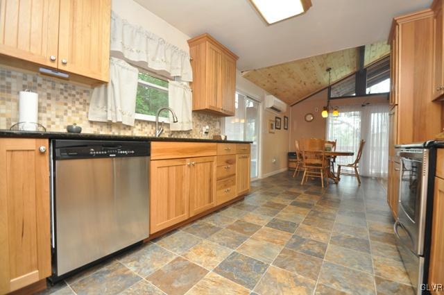 1251 Glenbrook Road Bartonsville, PA 18321 - Photo 10 of 37 a kitchen with stainless steel appliances granite countertop a sink and cabinets
