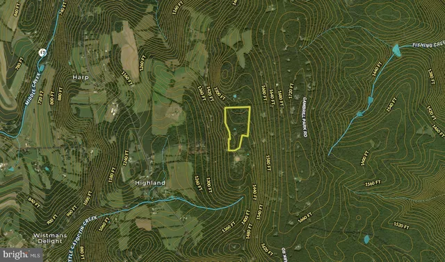 a view of a dining room with furniture and a window