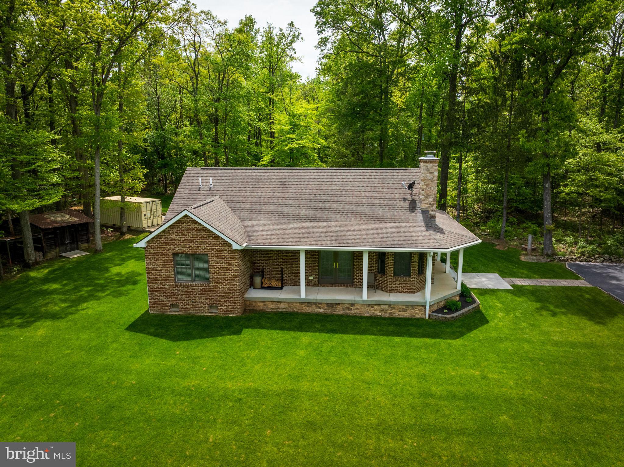 4740 Ford Fields Road Myersville, MD 21773 - Photo 28 of 147 a aerial view of a house with a yard table and chairs