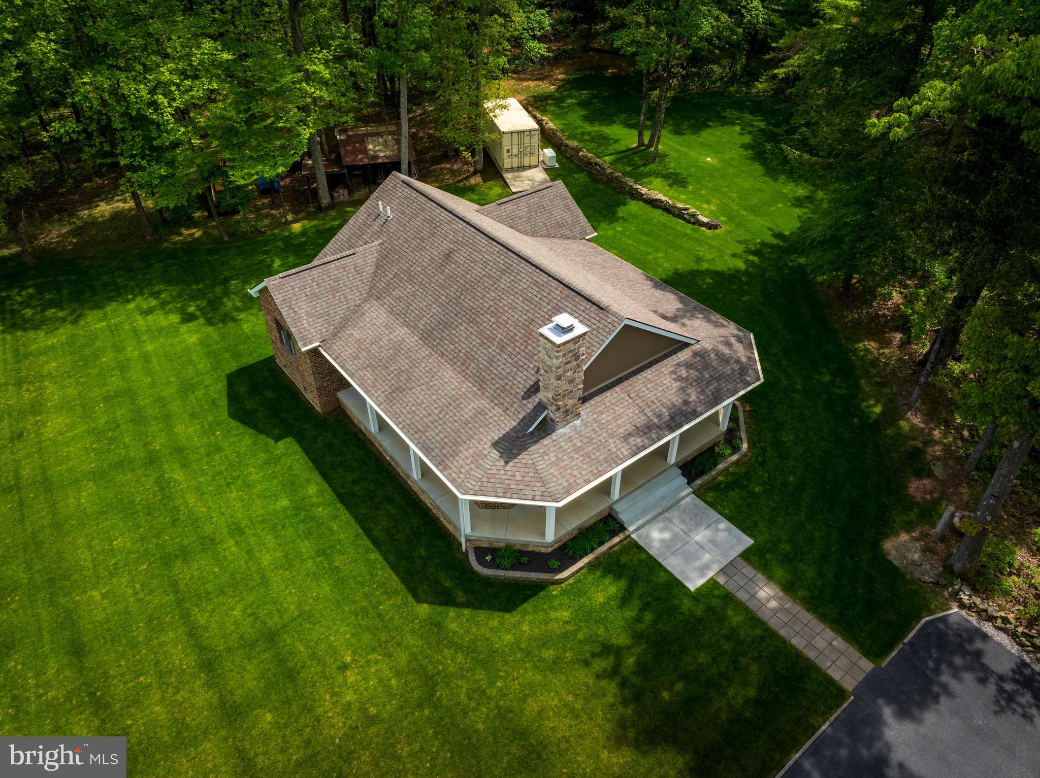 4740 Ford Fields Road Myersville, MD 21773 - Photo 3 of 147 a view of a backyard with a garden