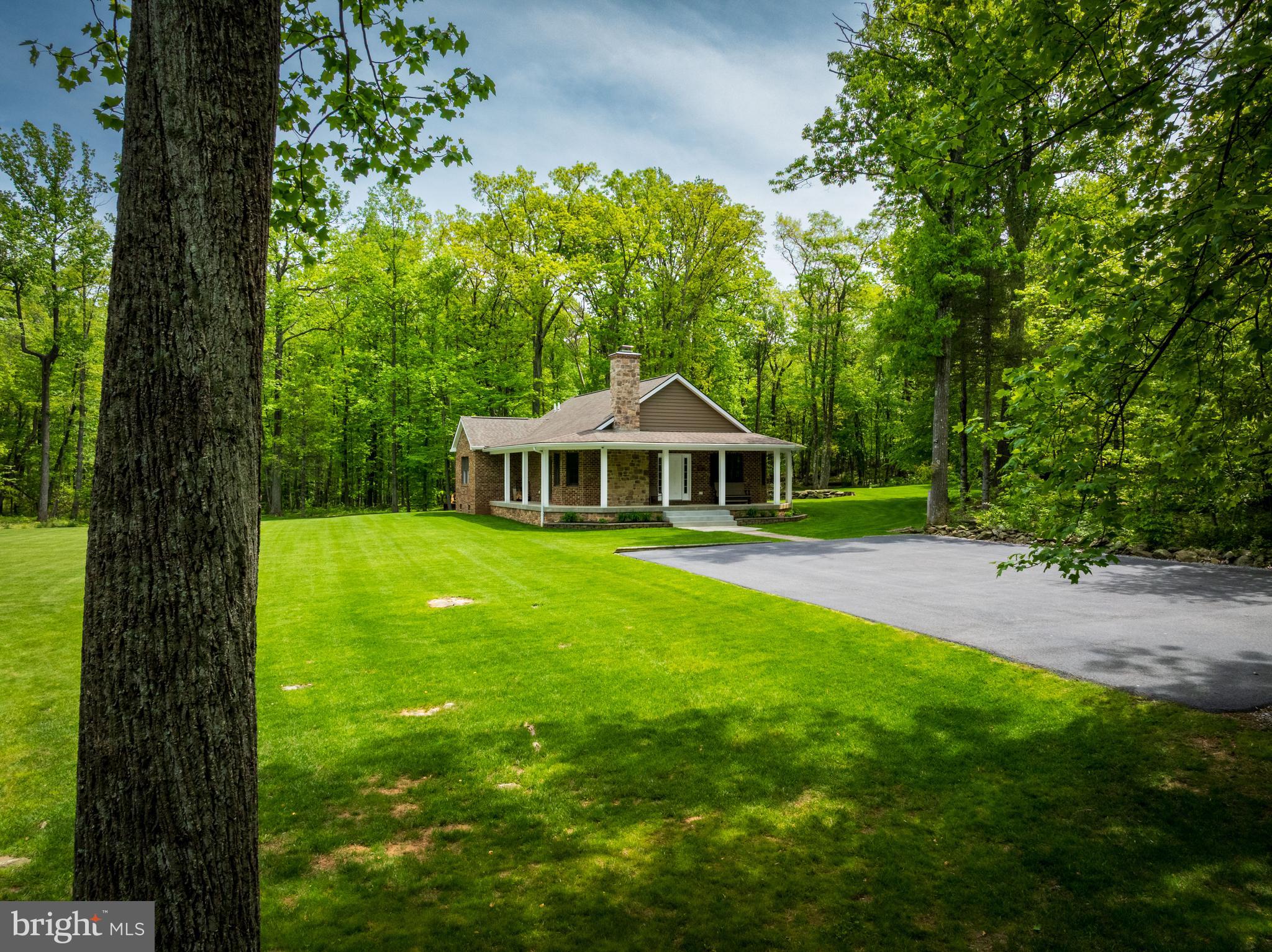 4740 Ford Fields Road Myersville, MD 21773 - Photo 35 of 147 a front view of a house with garden